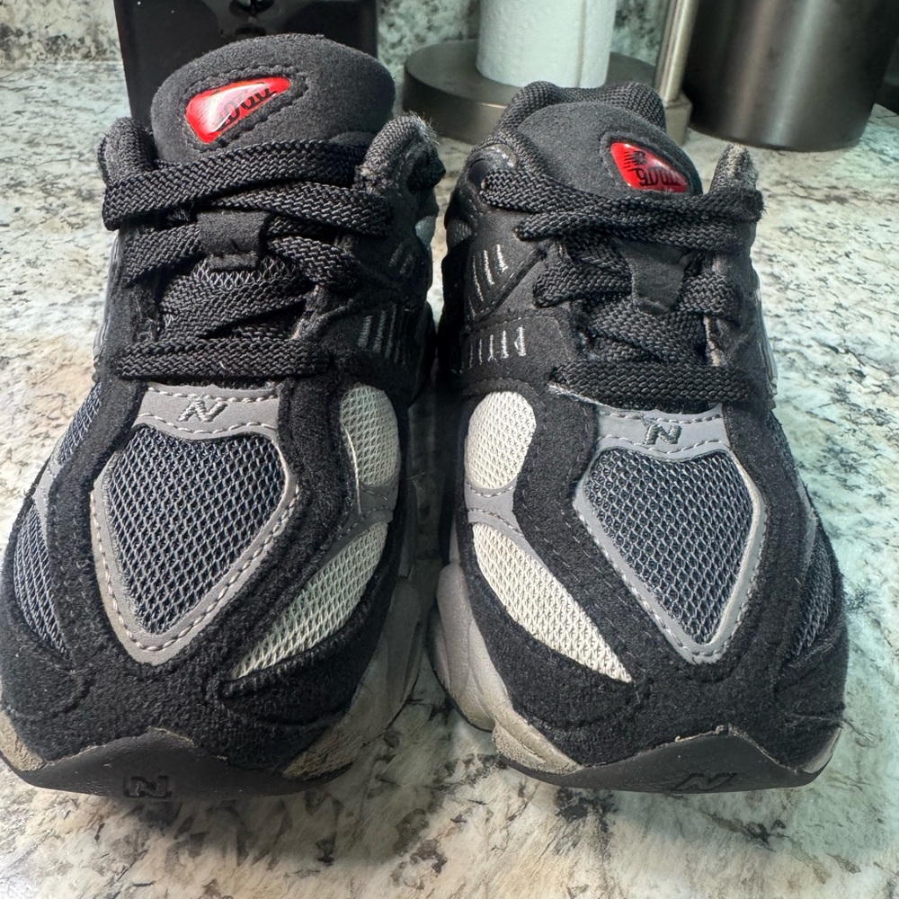 New Balance Kids' Black and Gray Sneakers with Red Accents